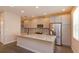 Modern kitchen features an island, stainless steel appliances, and stylish backsplash at 810 Greybull Run, Lake Mary, FL 32746