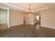 Open-concept living room with wood floors, recessed lighting, and view of the kitchen and stairway at 810 Greybull Run, Lake Mary, FL 32746