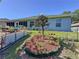 A backyard with a small magnolia tree and other landscaping at 827 Princeton Dr, Clermont, FL 34711