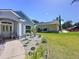 Home exterior featuring a beautifully landscaped front yard, sidewalk and view of the side yard and driveway at 827 Princeton Dr, Clermont, FL 34711