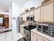 Kitchen featuring stainless steel appliances, neutral cabinetry, and an eat in breakfast nook at 827 Princeton Dr, Clermont, FL 34711