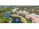 An aerial view of a beautiful condo community surrounded by ponds and lush green landscaping at 8296 Portofino Dr # 405, Davenport, FL 33896