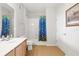 Bathroom showcasing a vanity and shower with colorful shower curtain at 8296 Portofino Dr # 405, Davenport, FL 33896
