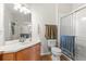 Bathroom with tile flooring, vanity, and glass shower at 8296 Portofino Dr # 405, Davenport, FL 33896