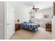 Cozy bedroom with neutral carpet and ceiling fan at 8296 Portofino Dr # 405, Davenport, FL 33896