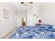 Bedroom featuring floral patterned bedding and neutral carpet at 8296 Portofino Dr # 405, Davenport, FL 33896