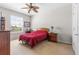 Bedroom featuring a ceiling fan, window, and cozy furnishings at 8296 Portofino Dr # 405, Davenport, FL 33896
