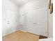 Neutral entryway with three doors and tile floors at 8296 Portofino Dr # 405, Davenport, FL 33896