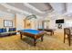 Spacious game room with two pool tables, overhead lighting, and comfortable seating at 8296 Portofino Dr # 405, Davenport, FL 33896