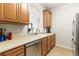 Bright kitchen with light colored cabinets, countertops, and tiled floor at 8296 Portofino Dr # 405, Davenport, FL 33896