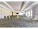 Well-lit meeting room with rows of chairs and large windows overlooking the outside at 8296 Portofino Dr # 405, Davenport, FL 33896