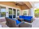 Cozy outdoor patio with comfortable seating and a ceiling fan for pleasant gatherings at 8296 Portofino Dr # 405, Davenport, FL 33896