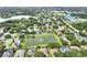 Aerial view of a planned community with homes surrounding a lake at 849 Shadowmoss Dr, Winter Garden, FL 34787