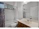 Bathroom with a shower-tub, a toilet, and a vanity with a sink and mirror at 849 Shadowmoss Dr, Winter Garden, FL 34787