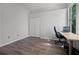 Room with wood floors, a closet, a desk, and a window to bring in natural light at 849 Shadowmoss Dr, Winter Garden, FL 34787
