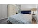 Bedroom with a full bed, wardrobe and side table with a lamp at 849 Shadowmoss Dr, Winter Garden, FL 34787