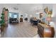 Expansive living area featuring hardwood flooring, elegant decor, and ample space for entertaining at 849 Shadowmoss Dr, Winter Garden, FL 34787