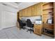 Home office featuring built-in cabinets and a dual workstation at 849 Shadowmoss Dr, Winter Garden, FL 34787