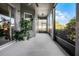 Cozy screened patio with an outdoor plant and view of the backyard at 849 Shadowmoss Dr, Winter Garden, FL 34787