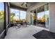 Relaxing screened patio featuring a ceiling fan, patio chairs, and outdoor views at 849 Shadowmoss Dr, Winter Garden, FL 34787