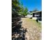 Large backyard featuring lush green grass, a covered structure and potential for outdoor activities at 855 Marion Dr, Mount Dora, FL 32757