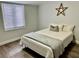Bedroom featuring a comfortable bed, hardwood floors, and neutral wall colors at 855 Marion Dr, Mount Dora, FL 32757