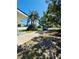 Long driveway leads to a home with mature landscaping at 855 Marion Dr, Mount Dora, FL 32757