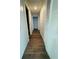 Hallway featuring hardwood floors, closet space, and neutral wall colors at 855 Marion Dr, Mount Dora, FL 32757