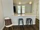 Breakfast bar featuring a white countertop and stainless steel stools at 855 Marion Dr, Mount Dora, FL 32757