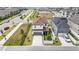 Aerial view of a two-story home featuring lush landscaping and an attached two-car garage at 8573 Lamppost Ln, Orlando, FL 32832