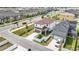 An aerial view of the residence, displaying its location within the neighborhood, landscaping, and the surrounding streets at 8573 Lamppost Ln, Orlando, FL 32832