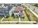 A beautiful aerial view of a two-story home with well-manicured landscaping at 8573 Lamppost Ln, Orlando, FL 32832