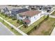 An aerial view of a beautifully landscaped two-story home in a residential neighborhood at 8573 Lamppost Ln, Orlando, FL 32832