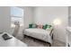 This cozy bedroom features a daybed with pillows and a desk, offering a comfortable and functional living space at 8573 Lamppost Ln, Orlando, FL 32832