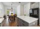 Bright dining area featuring a table with seating and sliding glass doors at 8573 Lamppost Ln, Orlando, FL 32832