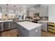 Modern kitchen with grey cabinets, stainless steel appliances, and center island at 8573 Lamppost Ln, Orlando, FL 32832