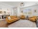 Spacious living room with open layout, wood floors, and modern furniture at 8573 Lamppost Ln, Orlando, FL 32832