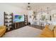 Open-concept living space with modern furnishings flowing into a bright kitchen at 8573 Lamppost Ln, Orlando, FL 32832