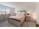 Comfortable main bedroom with a bed and a dresser with natural light coming from the window at 8573 Lamppost Ln, Orlando, FL 32832