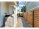 Brick patio features a grill, outdoor seating, and a privacy fence at 8665 Theiler St, Orlando, FL 32827