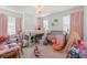Playful ' bedroom featuring a lofted bed, play area, and fun decor at 8665 Theiler St, Orlando, FL 32827