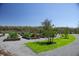 A well kept community garden with neat rows of raised garden beds and lovely landscaping at 8665 Theiler St, Orlando, FL 32827