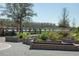 A meticulously designed community garden with raised beds and a charming wooden fence at 8665 Theiler St, Orlando, FL 32827