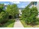 Traditional two-story home with fresh landscaping and a well-maintained walkway at 8665 Theiler St, Orlando, FL 32827