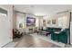 Bright living room featuring a fireplace, entertainment center, and comfortable seating at 8665 Theiler St, Orlando, FL 32827