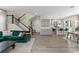 Open layout showcasing a kitchen, living room, and staircase at 8665 Theiler St, Orlando, FL 32827