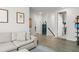 Inviting living room features wood floors and neutral paint with comfortable seating at 8665 Theiler St, Orlando, FL 32827
