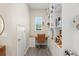 Cozy home office with custom built-in shelving, a desk, a chair, and a window for natural light at 8665 Theiler St, Orlando, FL 32827