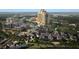 Aerial view of a luxury condo complex with a pool, townhouses, and lush landscaping at 10160 Autumn Mist Ln # 601, Golden Oak, FL 32836