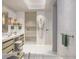 Spa-like bathroom with double vanity, soaking tub, walk-in shower, and elegant tile work at 10160 Autumn Mist Ln # 601, Golden Oak, FL 32836